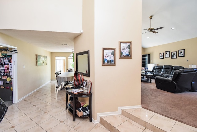 7719 Apache Plume Dr, Houston, TX 77071 - corridor with light tile patterned flooring, a towering ceiling, and light carpet