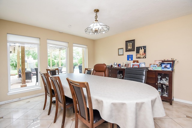 7719 Apache Plume Dr, Houston, TX 77071 - dining area featuring light tile patterned floors and baseboards
