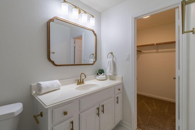 4310 Peppermint Hill Ln, Richmond, TX 77469 - bathroom featuring vanity and a walk in closet