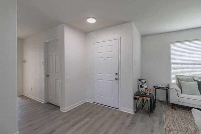4310 Peppermint Hill Ln, Richmond, TX 77469 - foyer featuring light wood-style flooring and baseboards