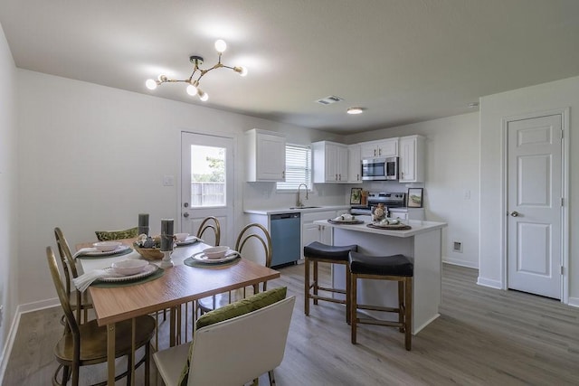 4310 Peppermint Hill Ln, Richmond, TX 77469 - dining space featuring light wood finished floors