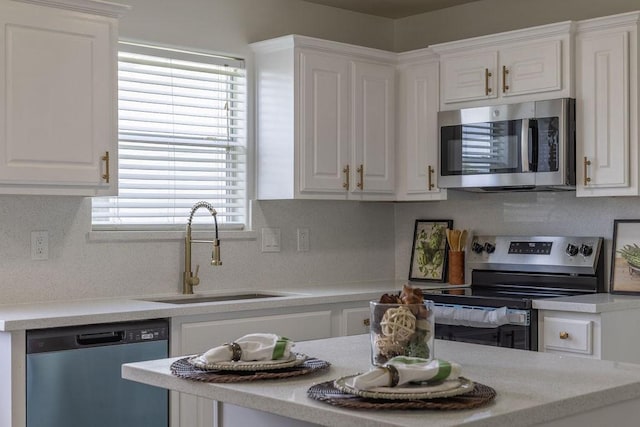 4310 Peppermint Hill Ln, Richmond, TX 77469 - kitchen featuring appliances with stainless steel finishes, white cabinets, and light countertops