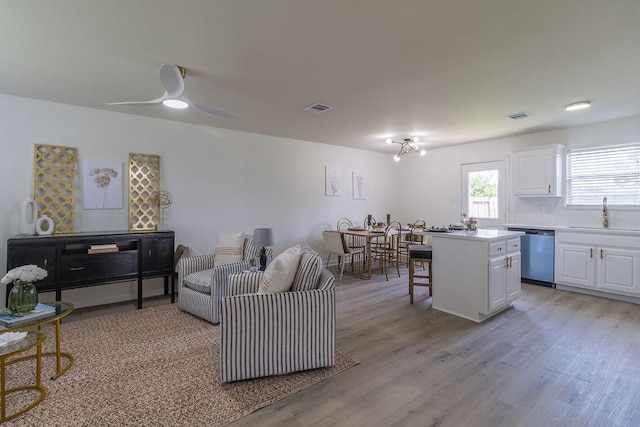 4310 Peppermint Hill Ln, Richmond, TX 77469 - living area with light wood-style flooring and a ceiling fan