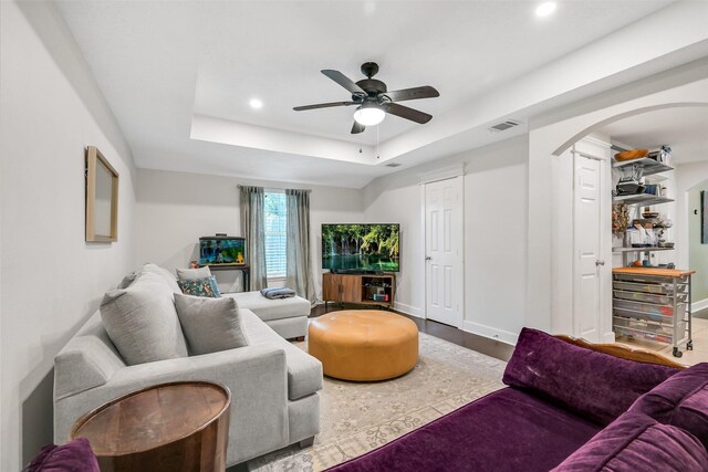 1731 W 22nd St, Houston, TX 77008 - living area with arched walkways, a ceiling fan, recessed lighting, a tray ceiling, and wood finished floors