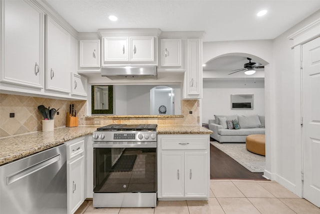 1731 W 22nd St, Houston, TX 77008 - kitchen featuring stainless steel appliances, ceiling fan, white cabinetry, light tile patterned floors, and recessed lighting
