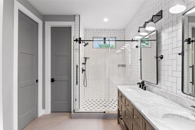 1412 Weiss St, Houston, TX 77009 - full bath featuring a stall shower, double vanity, tile patterned floors, and recessed lighting