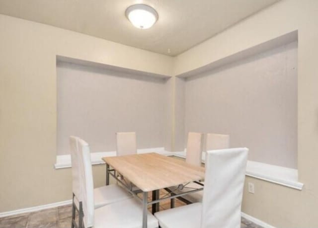 4803 Beechaven St, Houston, TX 77053 - dining room featuring baseboards