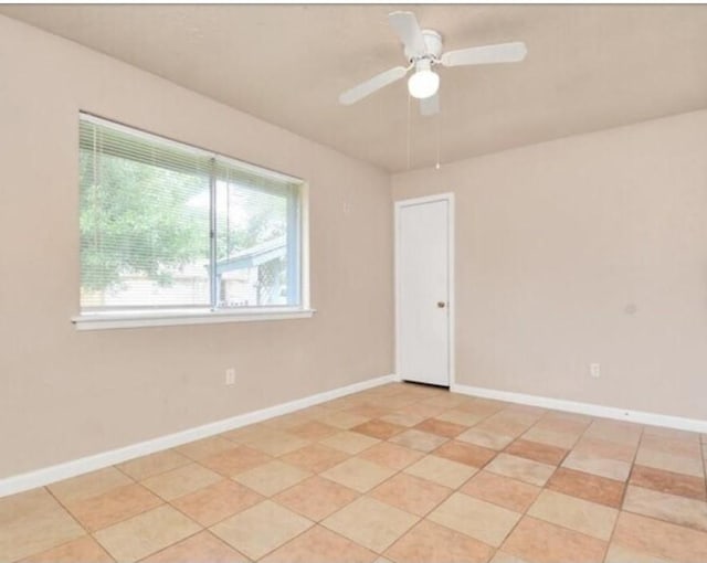 4803 Beechaven St, Houston, TX 77053 - spare room featuring light tile patterned floors and a ceiling fan