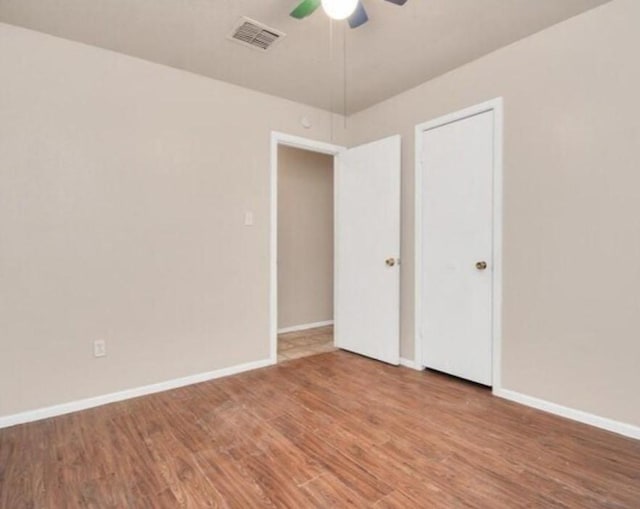 4803 Beechaven St, Houston, TX 77053 - unfurnished bedroom with wood finished floors and ceiling fan