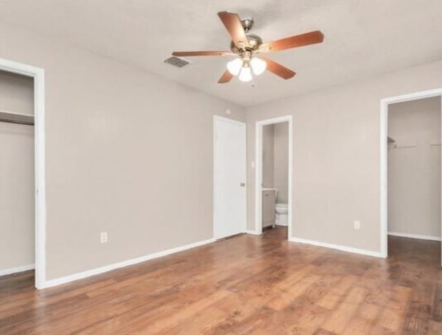 4803 Beechaven St, Houston, TX 77053 - unfurnished bedroom featuring a closet, wood finished floors, a spacious closet, ensuite bath, and ceiling fan
