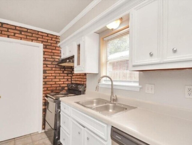 4803 Beechaven St, Houston, TX 77053 - kitchen featuring electric range, white cabinetry, light countertops, ornamental molding, and brick wall