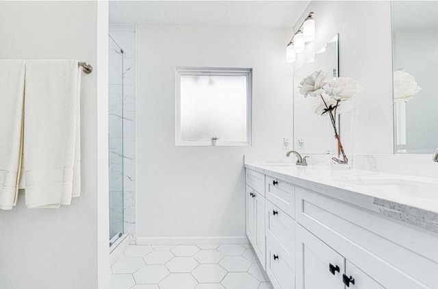 8614 Linkpass Ln, Houston, TX 77025 - bathroom with a shower, double vanity, and tile patterned floors