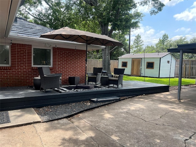 8614 Linkpass Ln, Houston, TX 77025 - view of patio with a wooden deck and an outbuilding