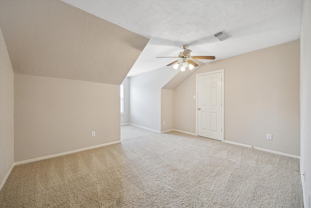 2411 Lacyberry St, Houston, TX 77080 - additional living space featuring light carpet, a ceiling fan, vaulted ceiling, and a textured ceiling