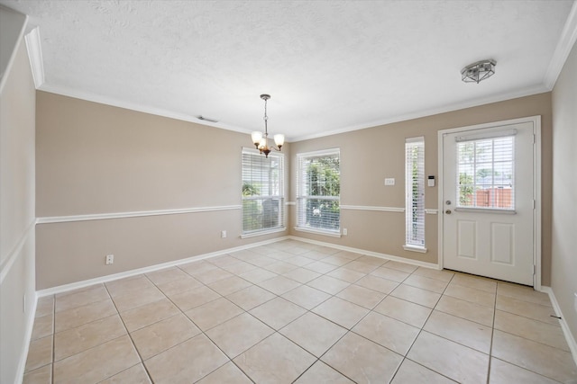 2411 Lacyberry St, Houston, TX 77080 - foyer featuring light tile patterned floors, ornamental molding, a chandelier, and a textured ceiling
