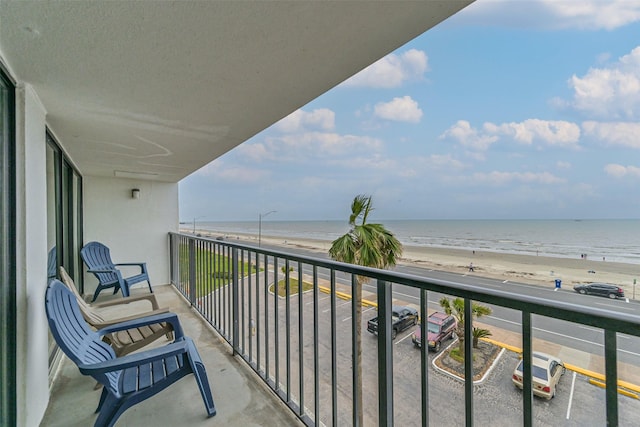 7310 Seawall Blvd Unit 404, Galveston, TX 77551 - balcony with view of water and beach