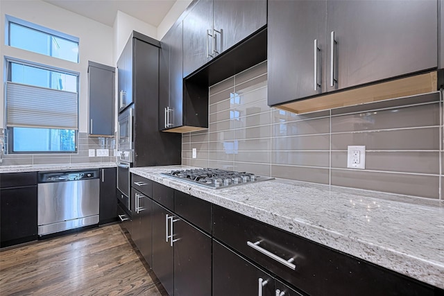 2205 Colorado St, Houston, TX 77007 - kitchen featuring stainless steel appliances, healthy amount of natural light, tasteful backsplash, and wood finished floors
