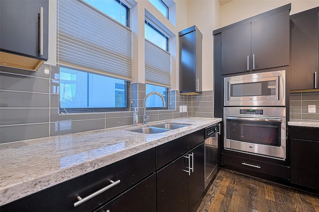 2205 Colorado St, Houston, TX 77007 - kitchen with stainless steel appliances, healthy amount of natural light, and dark cabinets