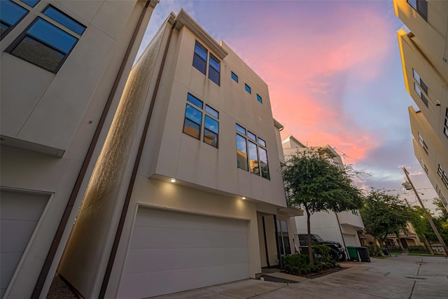 2205 Colorado St, Houston, TX 77007 - view of front of property with stucco siding and a garage