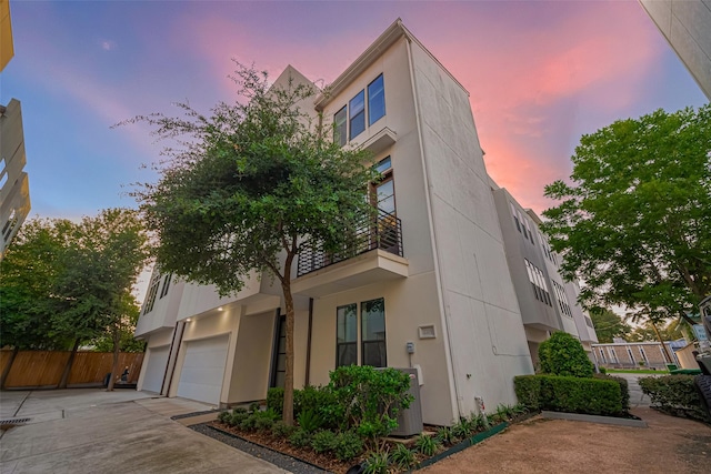 2205 Colorado St, Houston, TX 77007 - property at dusk featuring a garage