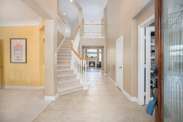 4619 Jade Green Ct, Houston, TX 77059 - foyer entrance with stairs, light tile patterned floors, and ornamental molding