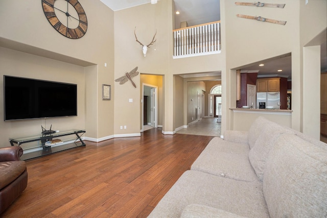 4619 Jade Green Ct, Houston, TX 77059 - living room featuring wood finished floors and a towering ceiling