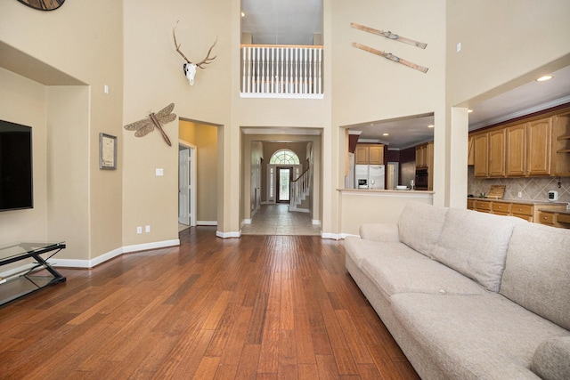 4619 Jade Green Ct, Houston, TX 77059 - living room with dark wood finished floors, a high ceiling, and recessed lighting