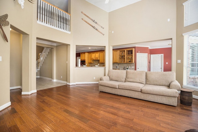 4619 Jade Green Ct, Houston, TX 77059 - living room with a high ceiling, hardwood / wood-style flooring, and stairway