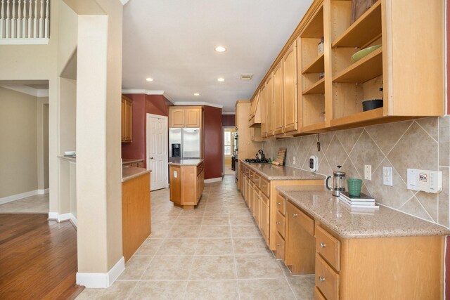 4619 Jade Green Ct, Houston, TX 77059 - kitchen with stainless steel refrigerator with ice dispenser, recessed lighting, decorative backsplash, ornamental molding, and light stone countertops