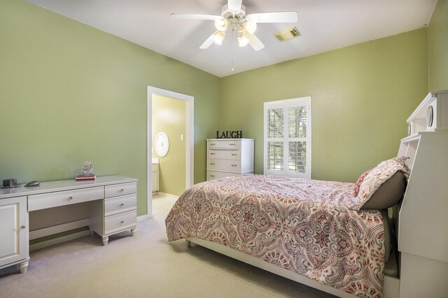 4619 Jade Green Ct, Houston, TX 77059 - bedroom with light colored carpet, a desk, connected bathroom, and ceiling fan