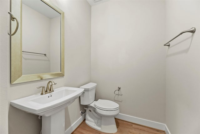 9418 Whispering Bald Cypress Ct, Cypress, TX 77433 - bathroom with wood finished floors and baseboards