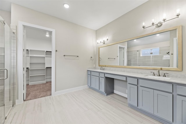 9418 Whispering Bald Cypress Ct, Cypress, TX 77433 - full bath with a shower stall, double vanity, a spacious closet, and recessed lighting