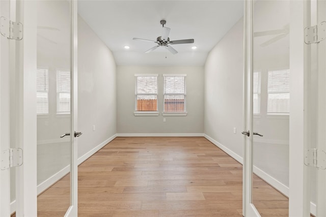 9418 Whispering Bald Cypress Ct, Cypress, TX 77433 - spare room with french doors, ceiling fan, light wood-type flooring, and recessed lighting