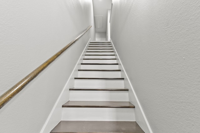 550 Wilcrest Dr Unit 550, Houston, TX 77042 - staircase with a textured wall
