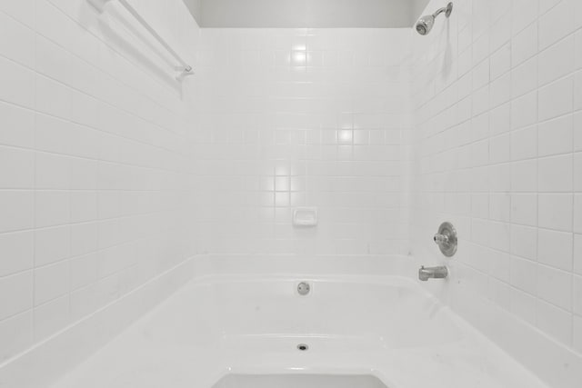 550 Wilcrest Dr Unit 550, Houston, TX 77042 - bathroom featuring washtub / shower combination