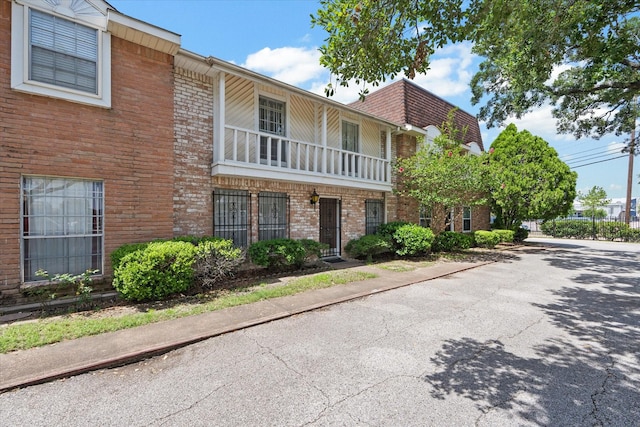 6697 De Moss Dr Unit 697, Houston, TX 77074 - view of front facade featuring brick siding