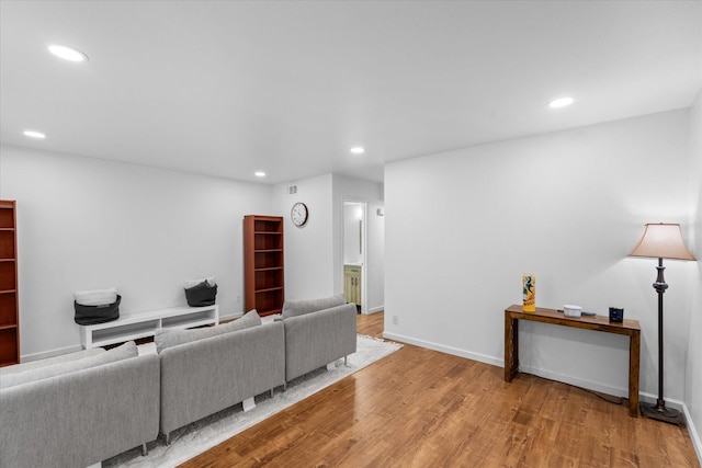 6697 De Moss Dr Unit 697, Houston, TX 77074 - living room featuring recessed lighting and wood finished floors