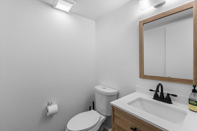 6697 De Moss Dr Unit 697, Houston, TX 77074 - bathroom featuring vanity and toilet