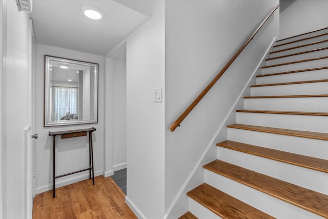 6697 De Moss Dr Unit 697, Houston, TX 77074 - stairway with wood finished floors and baseboards