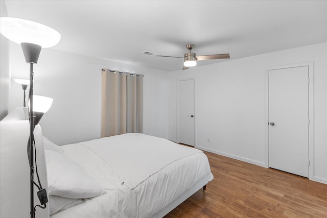 6697 De Moss Dr Unit 697, Houston, TX 77074 - bedroom featuring wood finished floors and ceiling fan