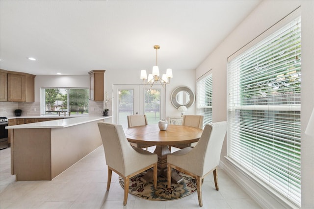 3403 Spring Arbor Ln, Sugar Land, TX 77479 - dining space featuring a chandelier, light tile patterned floors, and recessed lighting