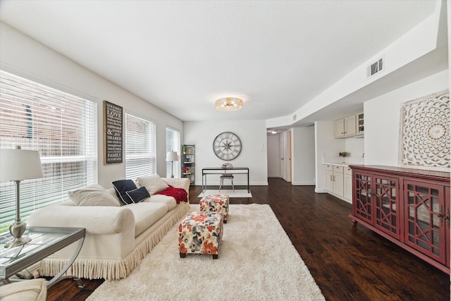 3403 Spring Arbor Ln, Sugar Land, TX 77479 - living area with dark wood-style flooring and baseboards