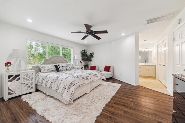 3403 Spring Arbor Ln, Sugar Land, TX 77479 - bedroom with wood finished floors, recessed lighting, a ceiling fan, and connected bathroom