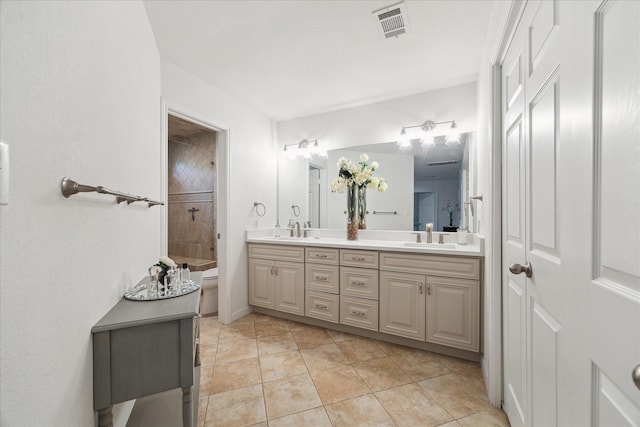 3403 Spring Arbor Ln, Sugar Land, TX 77479 - bathroom featuring double vanity, tile patterned flooring, and tiled shower / bath