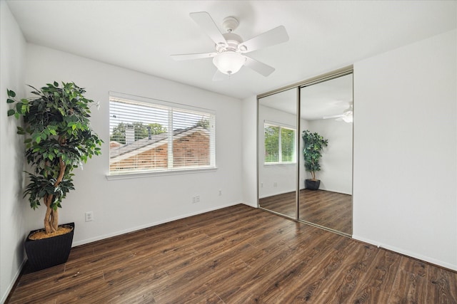 3403 Spring Arbor Ln, Sugar Land, TX 77479 - unfurnished bedroom with wood finished floors, a closet, and a ceiling fan