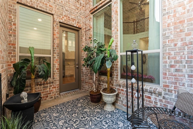 18247 Lakepoint Ridge Ln, Cypress, TX 77433 - view of exterior entry with brick siding and covered porch