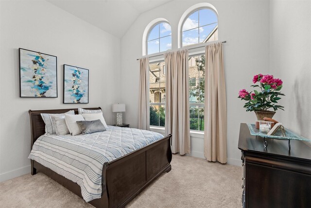 18247 Lakepoint Ridge Ln, Cypress, TX 77433 - bedroom featuring multiple windows, light colored carpet, and lofted ceiling