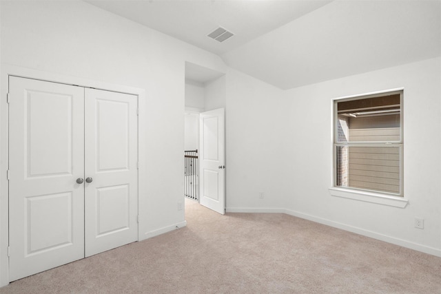 18247 Lakepoint Ridge Ln, Cypress, TX 77433 - unfurnished bedroom with carpet floors, lofted ceiling, and a closet