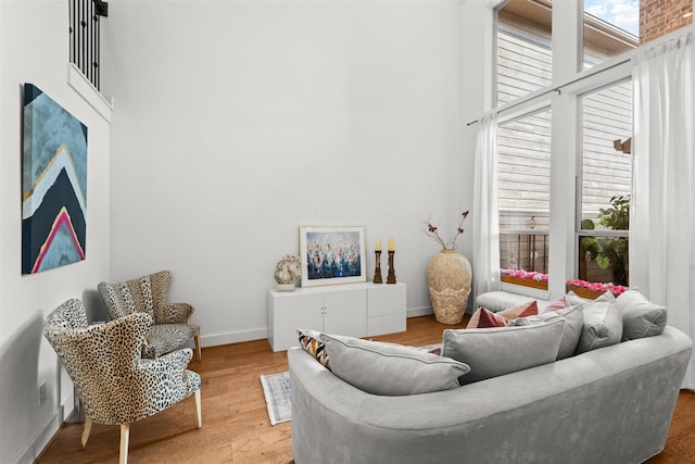 18247 Lakepoint Ridge Ln, Cypress, TX 77433 - living area featuring a towering ceiling and wood finished floors
