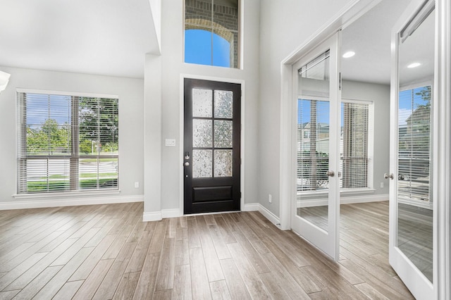 28702 Casen Ranch Ln, Fulshear, TX 77441 - foyer with light wood-style flooring and french doors